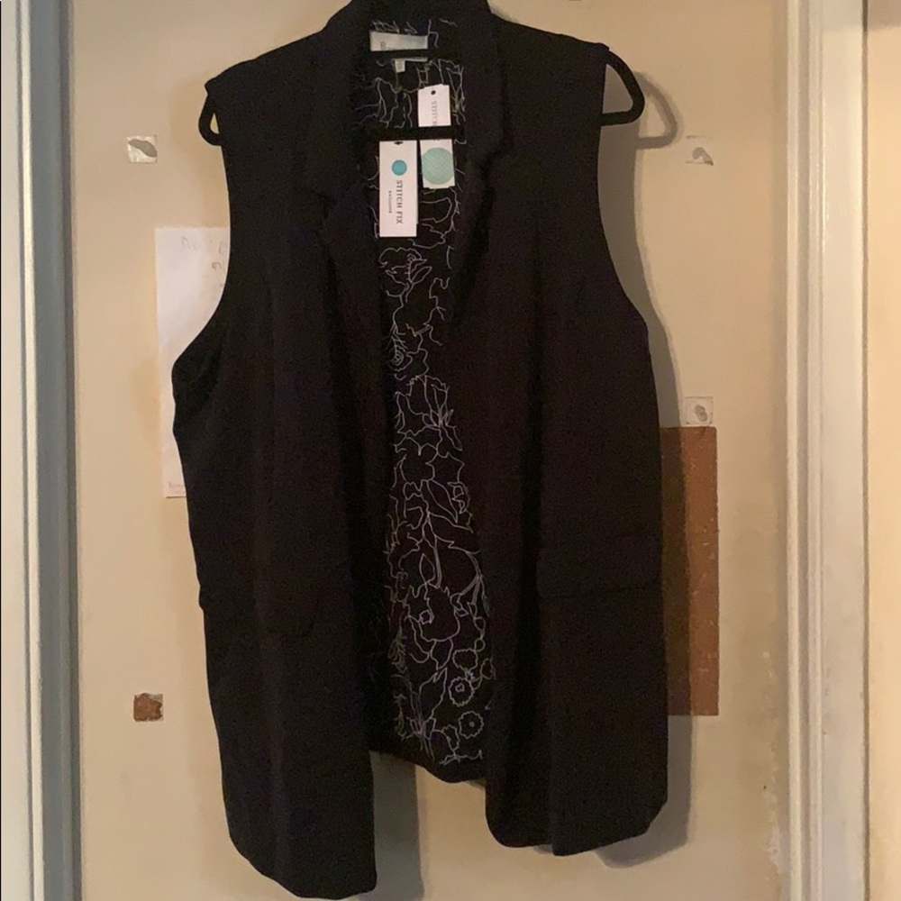 Black, dressy, blazer-style vest.
